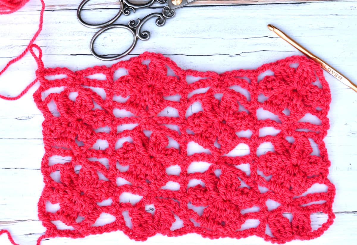 floral swatch in bright pin for demonstration of On the Vine Shawl stitch pattern