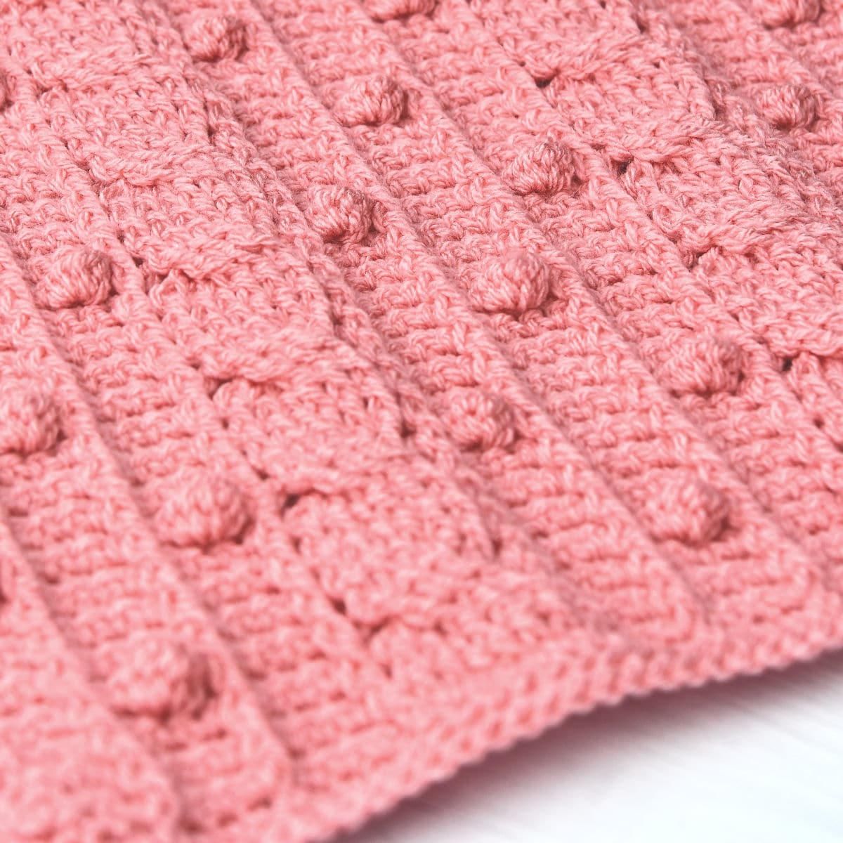 closeup of crochet cable stitch shawl in Stylecraft Special DK by Kim Guzman