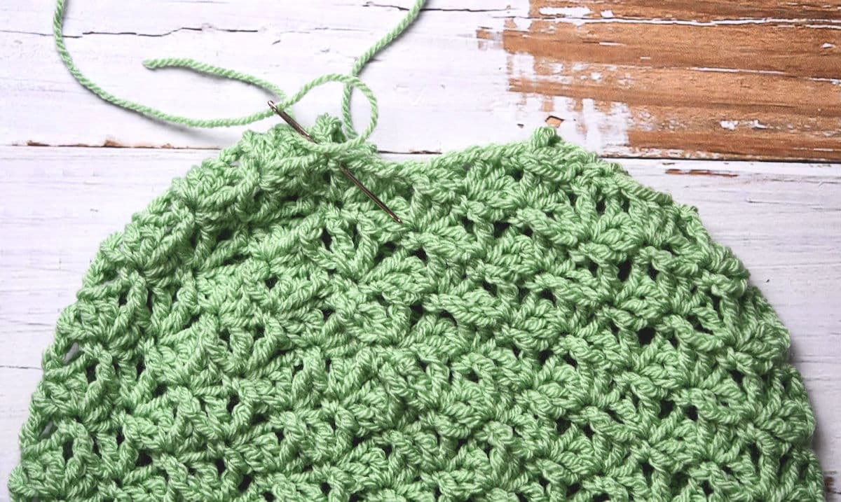 closeup of seaming top of crochet hat