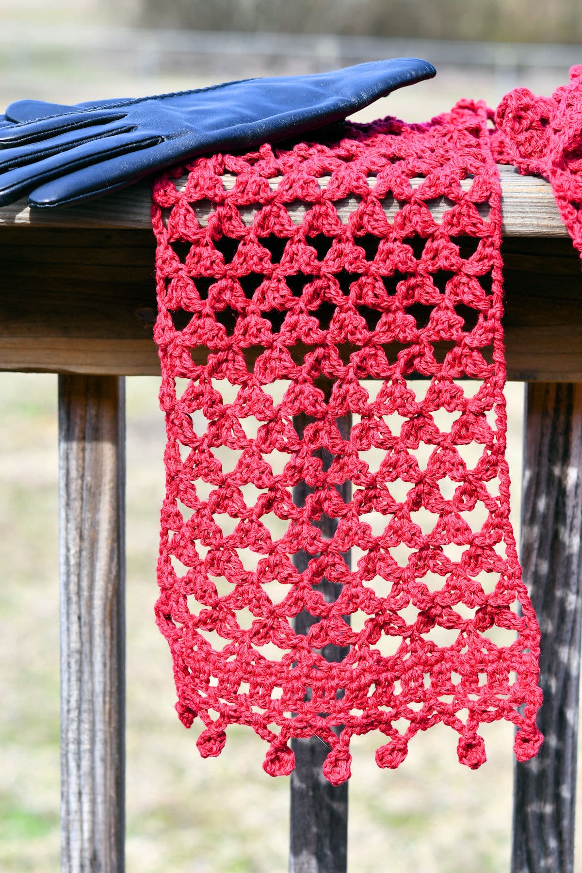 Mock Lovers Knot Scarf on a wood bannister