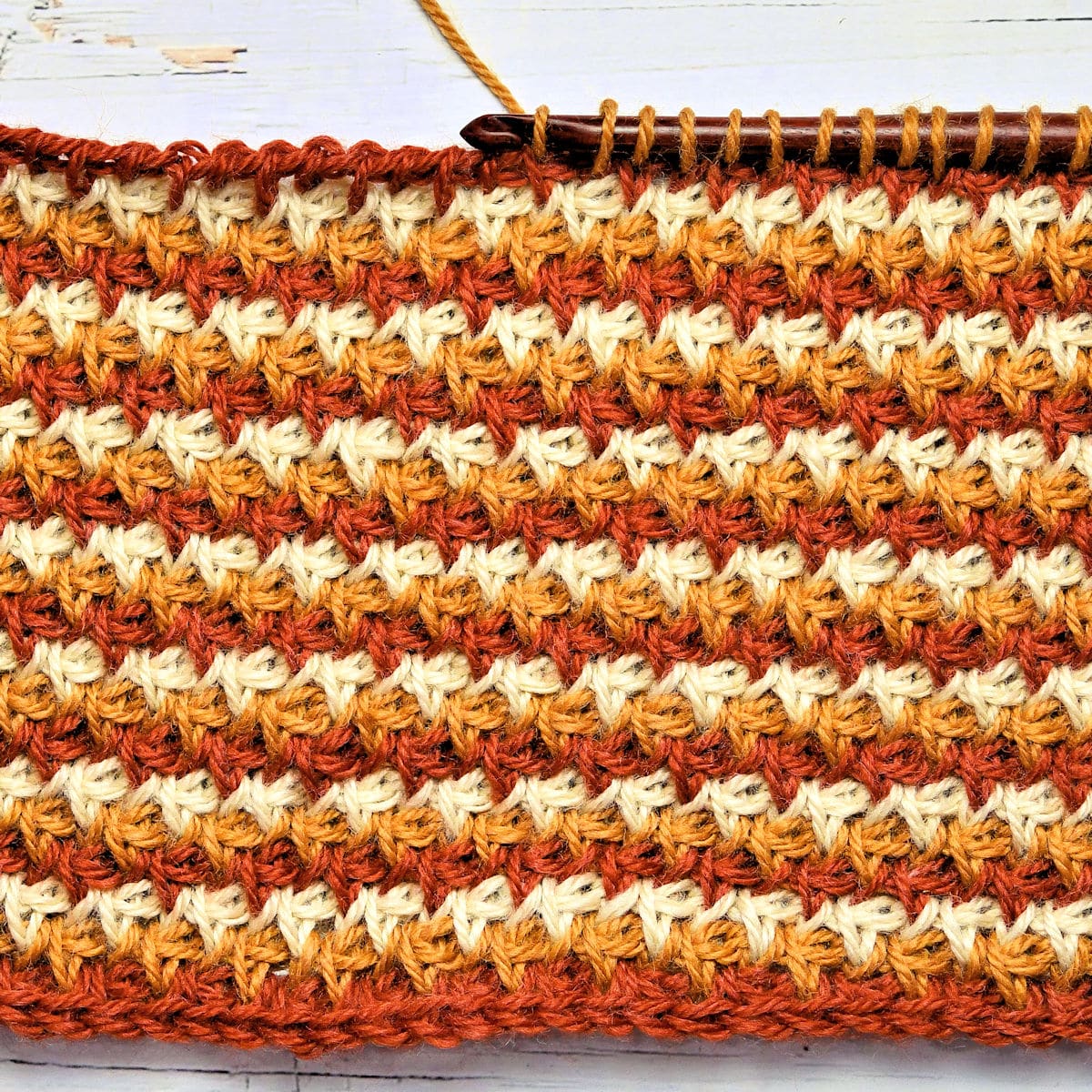 closeup of 3-color stitch pattern of Campfire Cowl