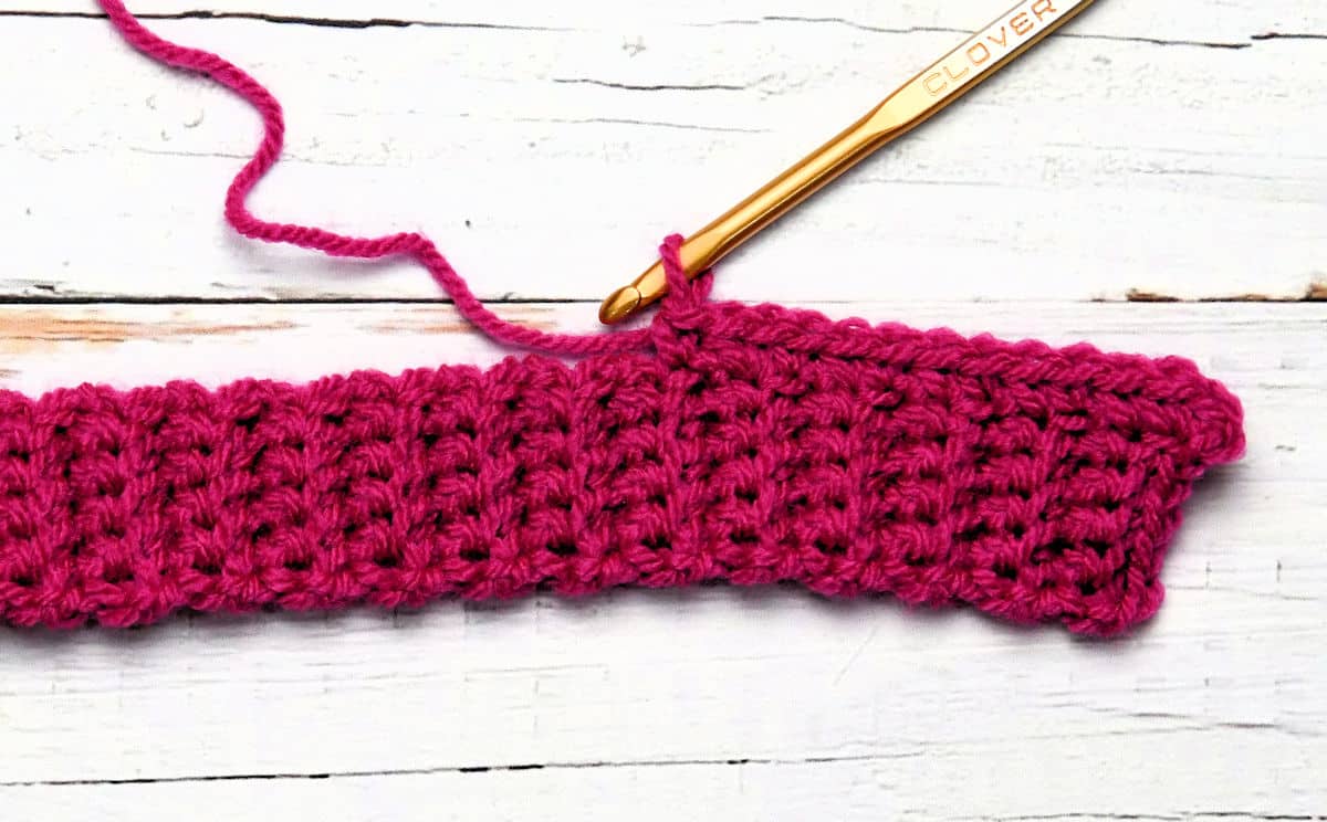 closeup of working along long edge of crochet ribbing