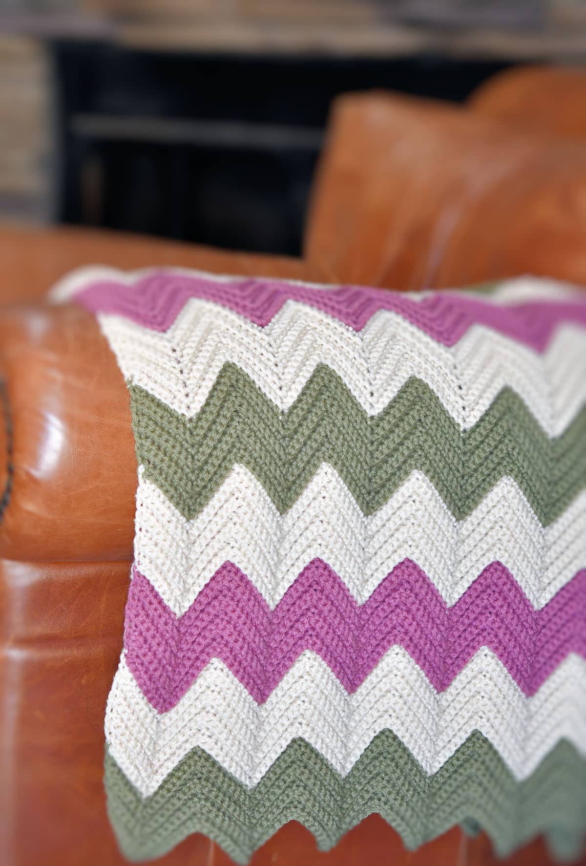 Grandma's Vintage Rpple Afghan on the side of a leather chair