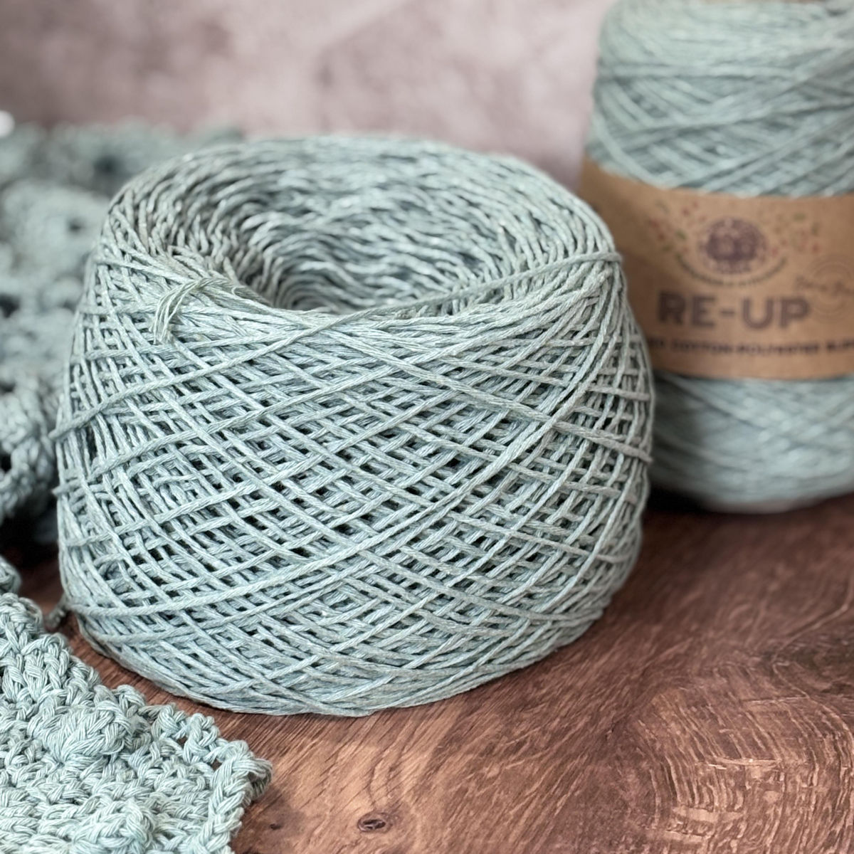 a cone of re-up Lion Brand cotton yarn, wound into a cake form