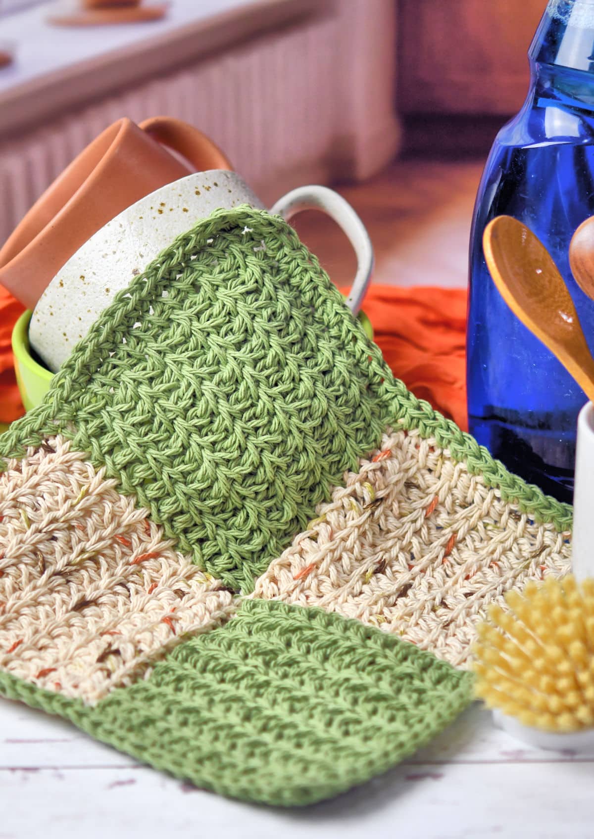 cotton washcloth in natural colors on a white wooden table.